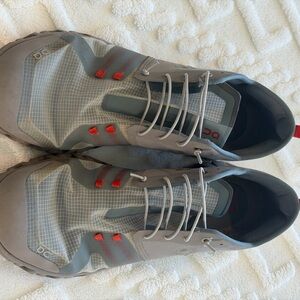 On Running Gray and Red Athletic Shoes